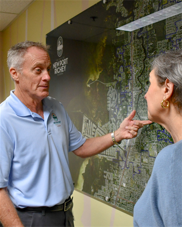 man showing a woman a map