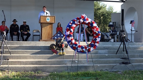9/11 memorial wreath in front of stage
