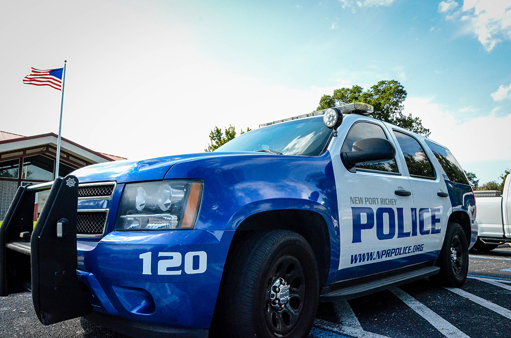 Closeup of a Ford SUV New Port Richey police cruiser. Number 120 is on the bumper.