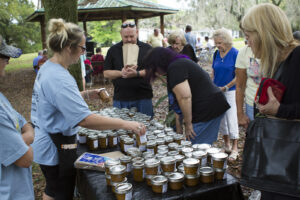Visitors explore loquat preserves at the Florida Loquat Festival